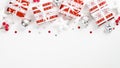 Christmas holiday presents over white background with red and silver decorations. Xmas frame top border made of gift boxes, stars Royalty Free Stock Photo