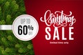 Christmas holiday sale 60 percent off with paper sticker on red background with fir tree branches. Limited time only Royalty Free Stock Photo