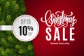 Christmas holiday sale 10 percent off with paper sticker on red background with fir tree branches. Limited time only Royalty Free Stock Photo