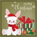 Christmas holiday season background with Cute rabbit with Santa hat, pine branch, gift box and Merry Christmas text. Royalty Free Stock Photo