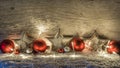 Christmas decoration with red balls, white stars lights over snow Royalty Free Stock Photo