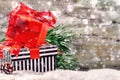 Christmas holiday setting with presents in boxes over snow Royalty Free Stock Photo