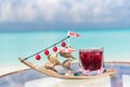 Christmas holiday signature cocktail on the glass table at the beach with ocean Royalty Free Stock Photo