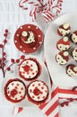 Christmas holiday Strawberry Santas with cherry red velvet cupcakes Royalty Free Stock Photo