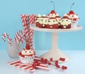 Christmas holiday Strawberry Santas with cherry red velvet cupcakes Royalty Free Stock Photo
