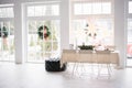 Christmas holiday table in a bright white living room in a house with French Windows