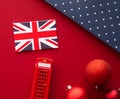 Christmas holiday tradition in United Kingdom and happy holidays flat lay, british flag, London telephone box and xmas