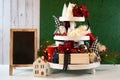 Christmas holiday on-trend Farmhouse aesthetic three tiered tray decor. Royalty Free Stock Photo