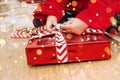 CHRISTMAS, HOLIDAYS AND CHILD CONCEPT, CLOSE-UP LITTLE BOY OPENING BOX GIFT OS SANTA CLAUS Royalty Free Stock Photo