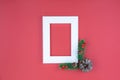 Christmas holidays composition, top view of red Christmas decorations and picture frame on red background with copy space for text Royalty Free Stock Photo