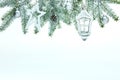 Christmas background with fir tree branch, decorative glass lantern, stars, balls and pine cone