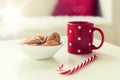 Close up of oat cookies, sugar cane candy and cup Royalty Free Stock Photo