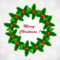 Christmas holly wreath with red berries on a snowy background Royalty Free Stock Photo