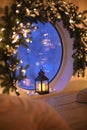 Christmas home decor. Atmospheric indoor photo with old vintage glowing lantern