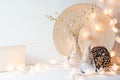 Christmas home decoration with lights on white wooden background. Royalty Free Stock Photo