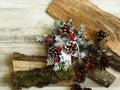 Christmas home decoration and pine cones  on timber wood and bleached oak background. Royalty Free Stock Photo