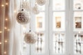 Christmas home decorations to spread holiday cheer. Interior details with white Christmas decoration balls, garlands