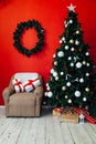 Christmas home interior Christmas tree red gifts new year decor festive background 2020 Royalty Free Stock Photo