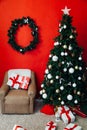 Christmas home interior Christmas tree red gifts new year decor festive background 2020 Royalty Free Stock Photo