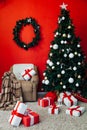 Christmas home interior Christmas tree red gifts new year decor festive background 2020 Royalty Free Stock Photo