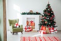 Christmas home interior Christmas tree red gifts new year decor festive background Royalty Free Stock Photo