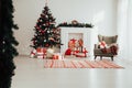 Christmas home interior Christmas tree red gifts new year decor festive background Royalty Free Stock Photo