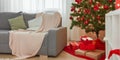 Christmas Home Interior. Stylish Living Room With Christmas Tree, Sofa and Gift Boxes With Presents Royalty Free Stock Photo