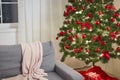 Christmas Home Interior. Stylish Living Room With Christmas Tree, Sofa and Gift Boxes With Presents Royalty Free Stock Photo