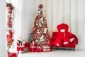Christmas home interior Christmas tree red gifts new year decor festive background. Royalty Free Stock Photo
