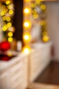 Christmas home room with a Christmas tree and festive bokeh lighting Royalty Free Stock Photo