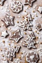 Christmas homemade chocolate cookies decorated with icing and powdered sugar on a wooden background Royalty Free Stock Photo