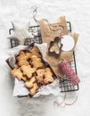 Christmas homemade edible gift - butter cookies and Christmas decor on a light background, top view