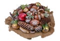 Christmas homemade garland made of natural forest objects - cones, acorns and nuts isolated macro