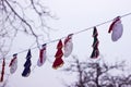 Christmas homemade garland outdoors in winter. Garland of snowmen and trees