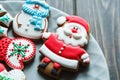 Christmas homemade gingerbread cookies, spices on the plate on dark wooden background among Christmas presents, top view. Royalty Free Stock Photo