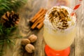 Christmas homemade sweet drink: eggnog with cinnamon, nutmeg and