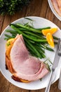 Christmas honey glazed ham served on a plate