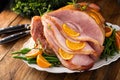 Christmas honey glazed ham spiral sliced stuffed with orange slices Royalty Free Stock Photo