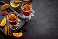 Christmas hot drink in glasses - mulled red wine with spices and decoration