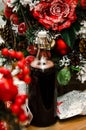 Christmas hot mulled wine with cinnamon, bottle of red on background christmas tree. Close up, copy space. Food and Royalty Free Stock Photo