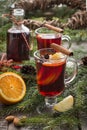 Christmas hot mulled wine with cinnamon, orange and christmas tree on black slate dish. Close up, copy space. Royalty Free Stock Photo