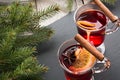 Christmas hot mulled wine with cinnamon and christmas tree on black slate dish. Top view, copy space. Royalty Free Stock Photo