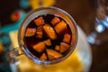 Christmas hot mulled wine with different fruits and spices, sel Royalty Free Stock Photo