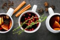 Christmas hot mulled wine or gluhwein drink in a cups with orange citrus,apple,cinnamon sticks and stars anise Royalty Free Stock Photo