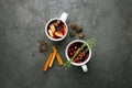 Christmas hot mulled wine or gluhwein drink in a cups with orange citrus,apple,cinnamon sticks and stars anise Royalty Free Stock Photo