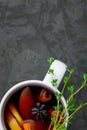 Christmas hot mulled wine or gluhwein drink in a cups with orange citrus,apple,cinnamon sticks and stars anise Royalty Free Stock Photo