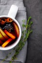 Christmas hot mulled wine or gluhwein drink in a cups with orange citrus,apple,cinnamon sticks and stars anise Royalty Free Stock Photo