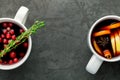 Christmas hot mulled wine or gluhwein drink in a cups with orange citrus,apple,cinnamon sticks and stars anise Royalty Free Stock Photo