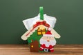 A Christmas house shape bag with medical masks concept of healthy holidays