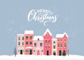 Christmas houses in snow, text Merry Christmas on greeting card. Vector winter town scenery illustration
